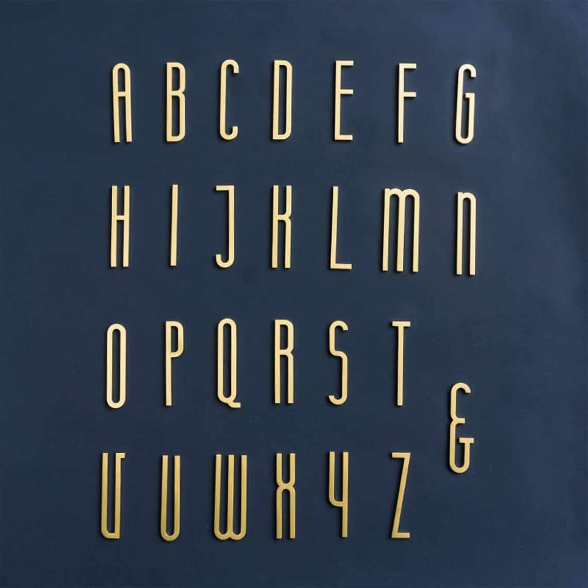 Laser-cut solid brass letters from 5mm sheet