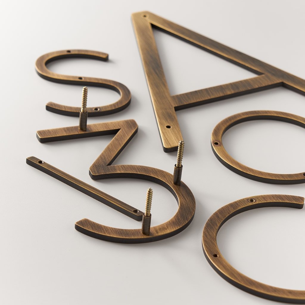 EZRA Characters in Antique Brass