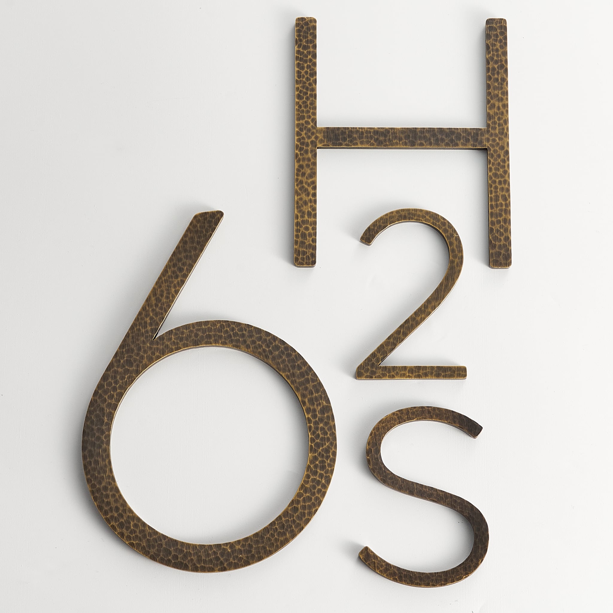 EZRA Characters in Hammered Antique Brass